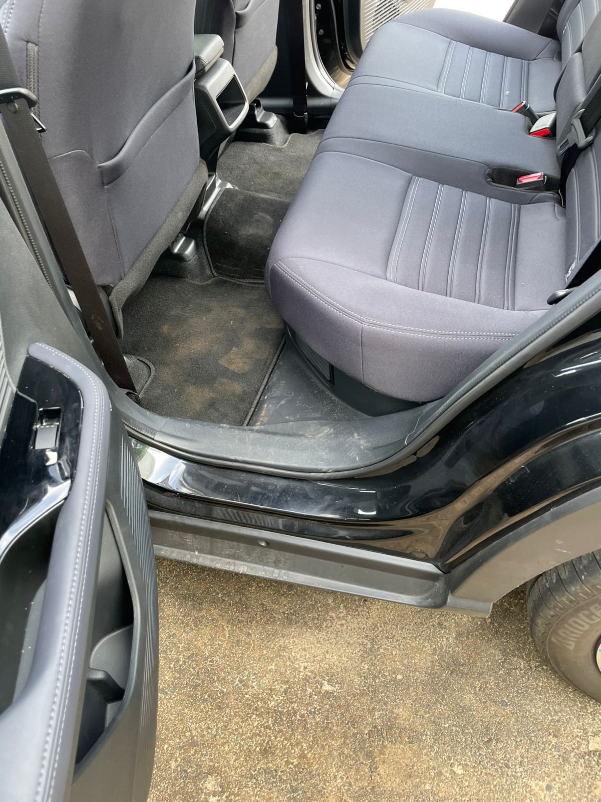 Car rear floor and mats — before cleaning