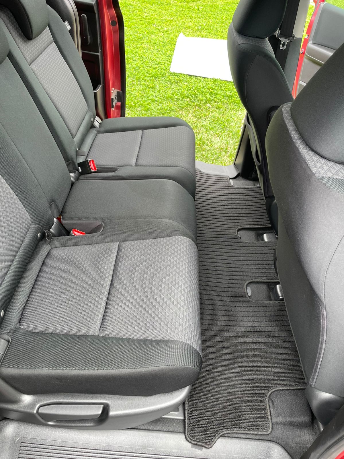 Spotless rear seats and floor mats after an interior detail